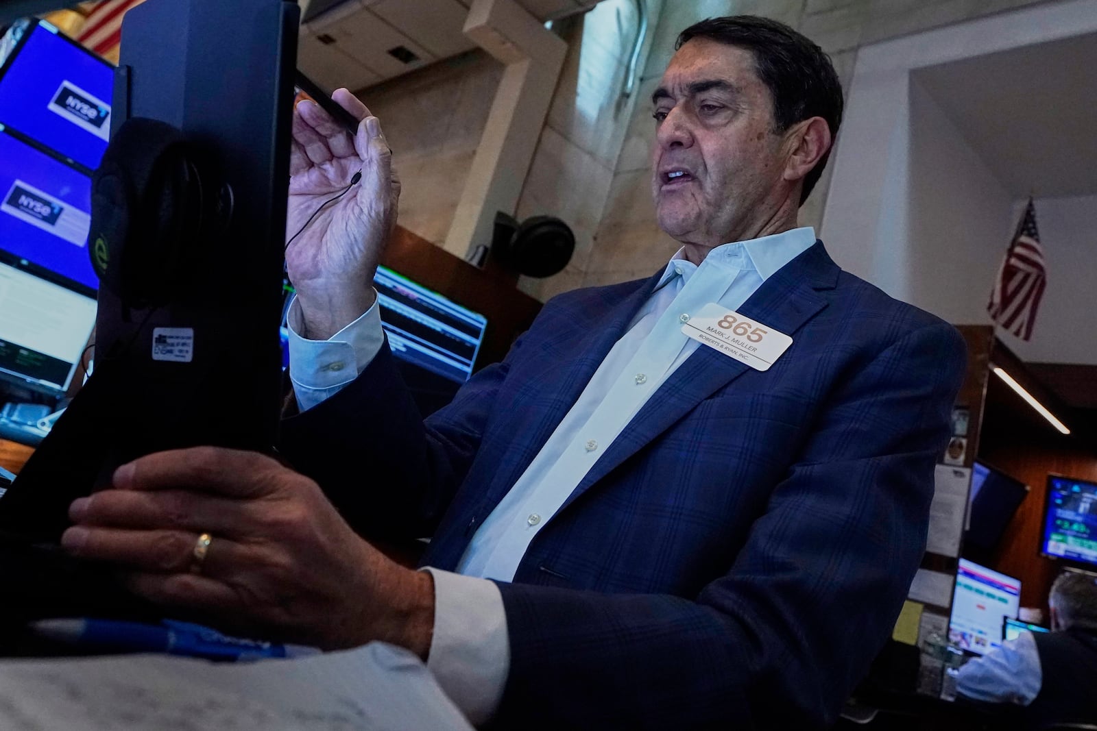Trader Mark Muller works on the floor of the New York Stock Exchange, Monday, May 12, 2025. (AP Photo/Richard Drew)