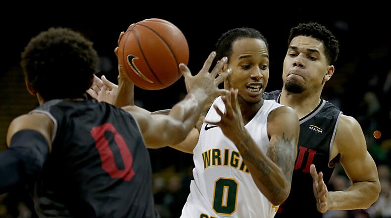 Wright State University guard Jaylon Hall cuts between IUPUI’s Jaylen Minnett (0) and Marcus Burk during a Horizon League game at the Nutter Center in Fairborn Sunday, Feb. 16, 2020. Wright State won 106-66. Contributed photo by E.L. Hubbard