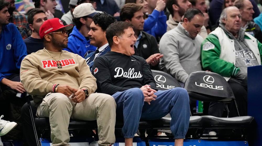 Mark Cuban, center, reacts to play in the first half of an NBA basketball game between the Minnesota Timberwolves and Dallas Mavericks Wednesday, Jan. 28, 2026, in Dallas. (AP Photo/Tony Gutierrez)