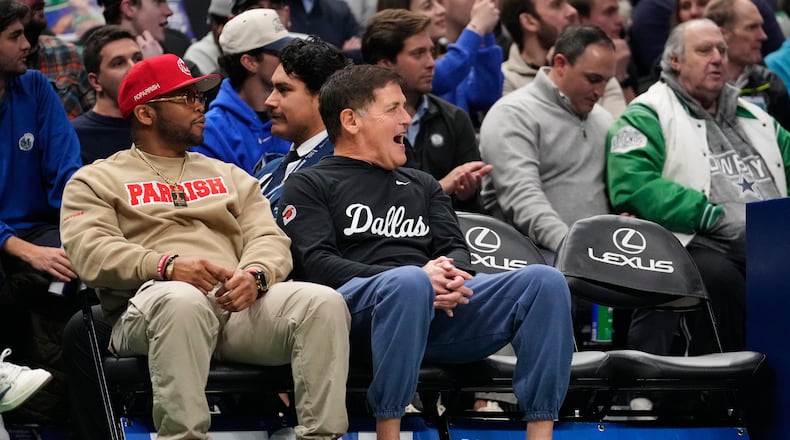 Mark Cuban, center, reacts to play in the first half of an NBA basketball game between the Minnesota Timberwolves and Dallas Mavericks Wednesday, Jan. 28, 2026, in Dallas. (AP Photo/Tony Gutierrez)