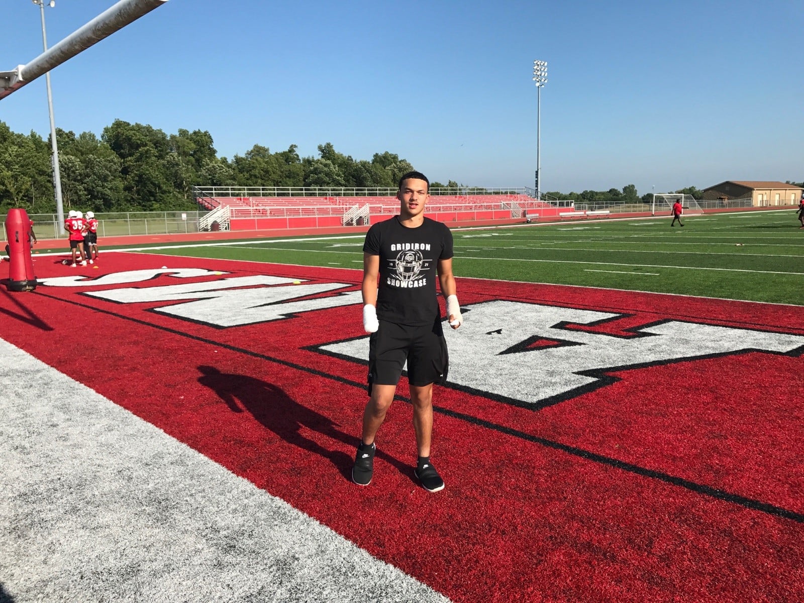 Issiah Evans stands at the edge of the Trotwood Madison field during summer workout in 2022. TOM ARCHDEACON/STAFF