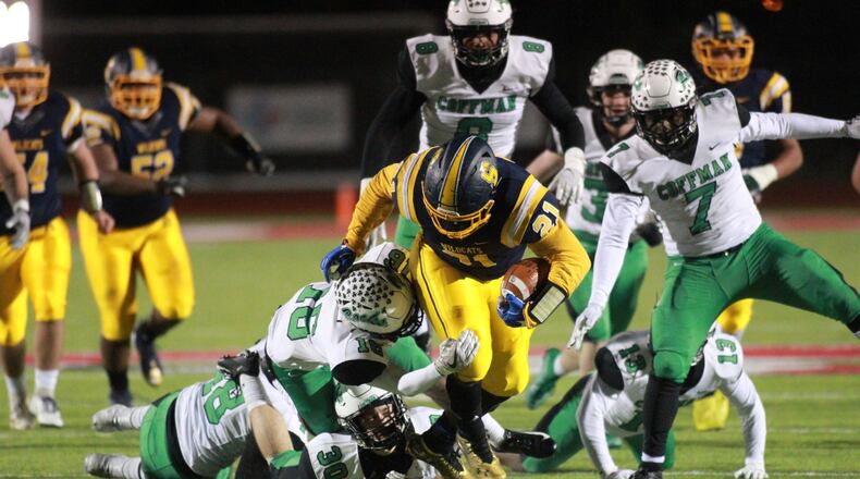Springfield’s Tavion Smoot runs against Dublin Coffman in a Division I, Region 2 final on Friday, Nov. 22, 2019, at London High School. David Jablonski/Staff