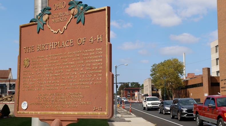 A Historical Marker outside the A.B. Graham Building Monday, Sept. 11, 2023 marks the building as the birthplace of 4-H. BILL LACKEY/STAFF