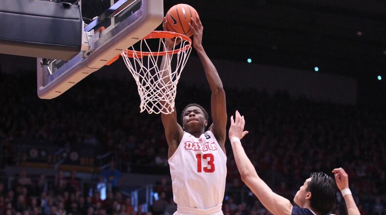 Dayton's Kostas Antetokounmpo dunks against George Washington's Yuta Watanabe on Saturday, March 3, 2018, at UD Arena.