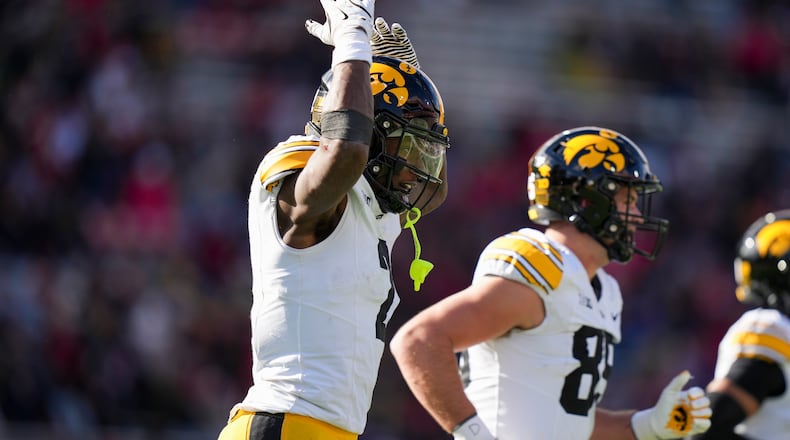 Iowa running back Kaleb Johnson (2) celebrates his touchdown during the first half of an NCAA college football game against Maryland, Saturday, Nov. 23, 2024, in College Park, Md. (AP Photo/Stephanie Scarbrough)