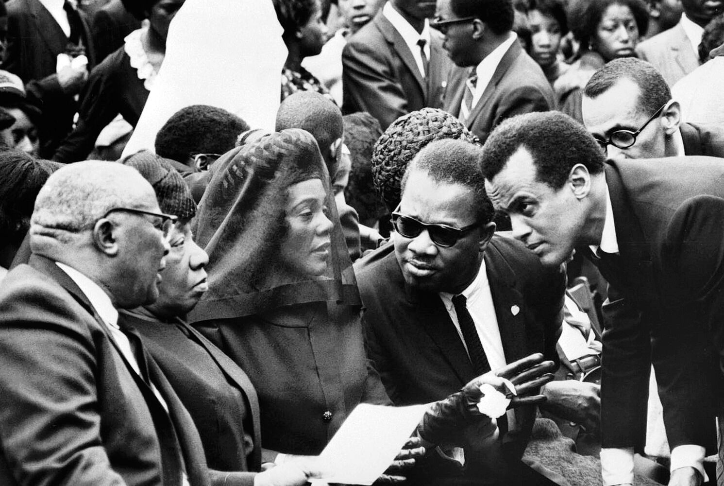 
                        FILE — At the funeral of the Rev. Martin Luther King Jr. in Atlanta, Harry Belafonte, right, speaks with, from left, the slain civil rights leader’s parents, the Rev. Martin Lther King Sr. and Alberta Williams King; his widow, Coretta Scott King; and his brother, the Rev. Alfred Daniel King, on April 9, 1968. Belafonte, who stormed the pop charts and smashed racial barriers in the 1950s with his highly personal brand of folk music, and who went on to become a major force in the civil rights movement, died on Tuesday, April 25, 2023, at his home on the Upper West Side of Manhattan. He was 96. (Don Hogan Charles/The New York Times)
                      