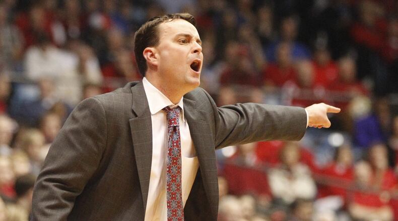 Dayton coach Archie Miller shouts instructions to his team during a game against Richmond on Saturday, March 8, 2014, at UD Arena. UD announced Monday that Miller had agreed to a contract extension through the 2018-19 season. David Jablonski/Staff