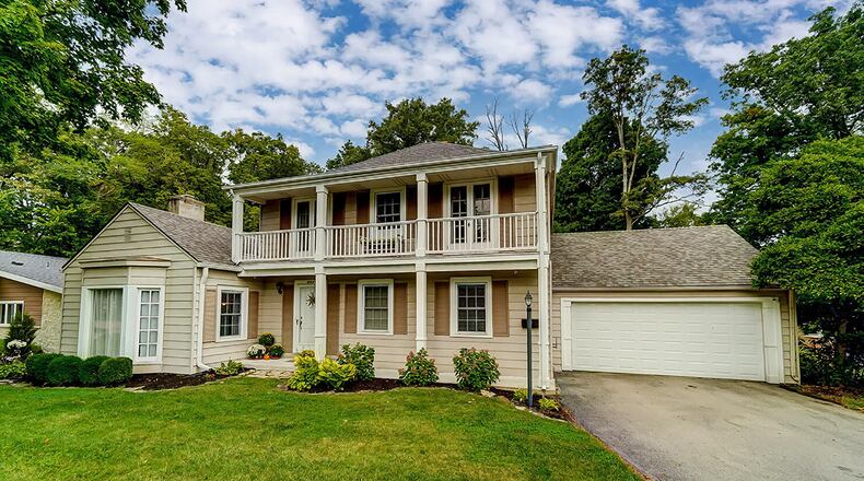 The 4-bedroom home includes about 1,880 sq. ft. of living space with a covered front porch and second-floor, covered balcony. The home also has a partially finished basement. CONTRIBUTED PHOTO