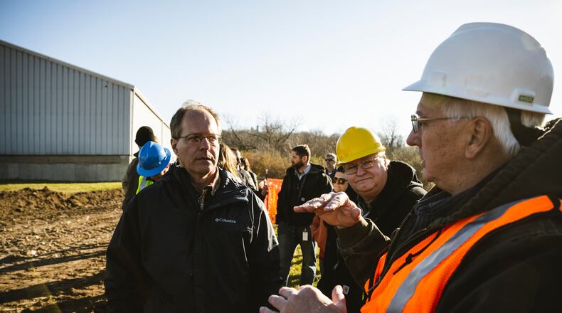 Environmental Protection Agency officials survey the work site Nov. 22 at Wright-Patterson Air Force Base. A 450-foot trench construction project in Area B is underway to help remove substances previously used in firefighting from groundwater. (U.S. Air Force photo by Hannah Carranza)
