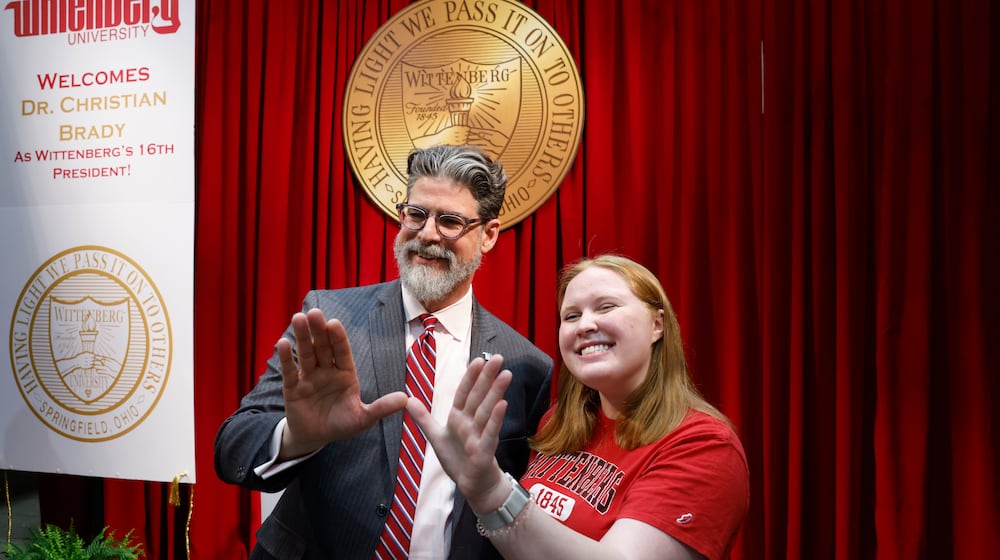 Dr. Christian M. M. Brady, left, takes a photo with junior Katie Lowry, student senate president, during an event where he was announced as the new president on Friday, May 9, 2025, at Wittenberg University. JOSEPH COOKE/STAFF