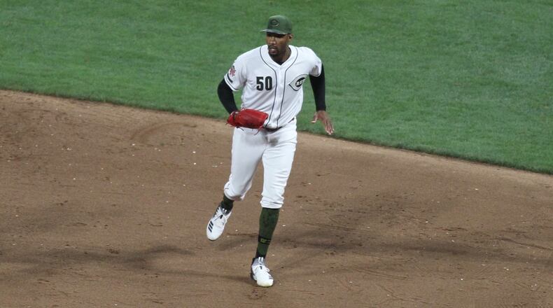 Reds reliever Amir Garrett reacts after getting the final out of the eighth inning against the Cubs on Friday, Aug. 9, 2019, at Great American Ball Park.