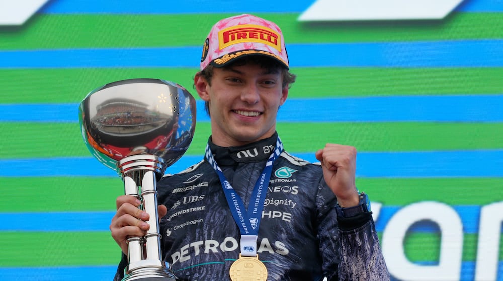 Mercedes driver Kimi Antonelli of Italy reacts on the podium after winning the Japanese Formula One Grand Prix at Suzuka in central Japan, Sunday, March 29, 2026. (AP Photo/Eugene Hoshiko)