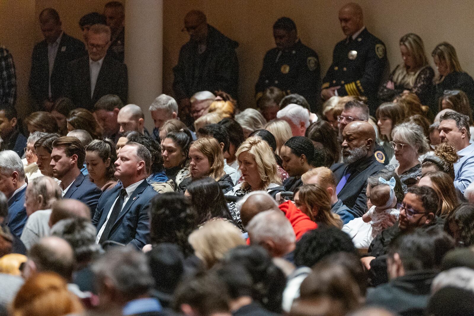 Guest observe 168 Seconds of Silence for victims of the Oklahoma City Bombing during the 30th anniversary memorial service for the victims of the 1995 Oklahoma City bombing, in Oklahoma City, Saturday, April 19, 2025. (AP Photo/Alonzo Adams)