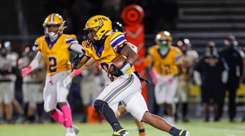 Springfield High School senior running back Deontre Long runs the ball during their game against Beavercreek on Friday, Oct. 10 at Wildcat Stadium. Springfield won 31-0. MICHAEL COOPER / STAFF PHOTO