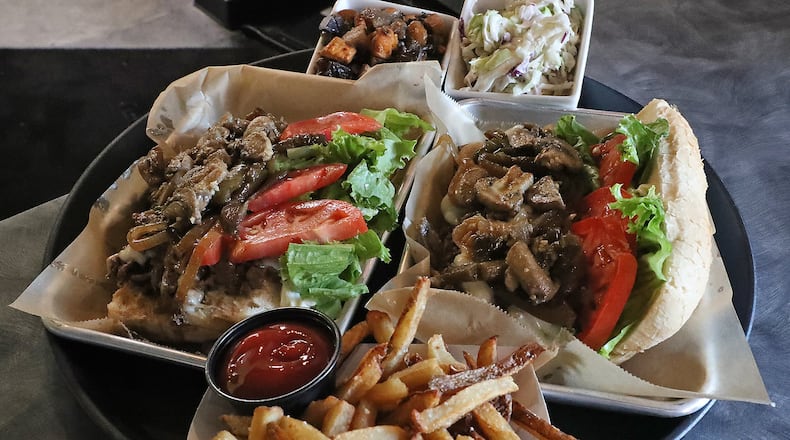 A couple sandwiches and some sides at Lincoln & Main Gastropub. BILL LACKEY/STAFF