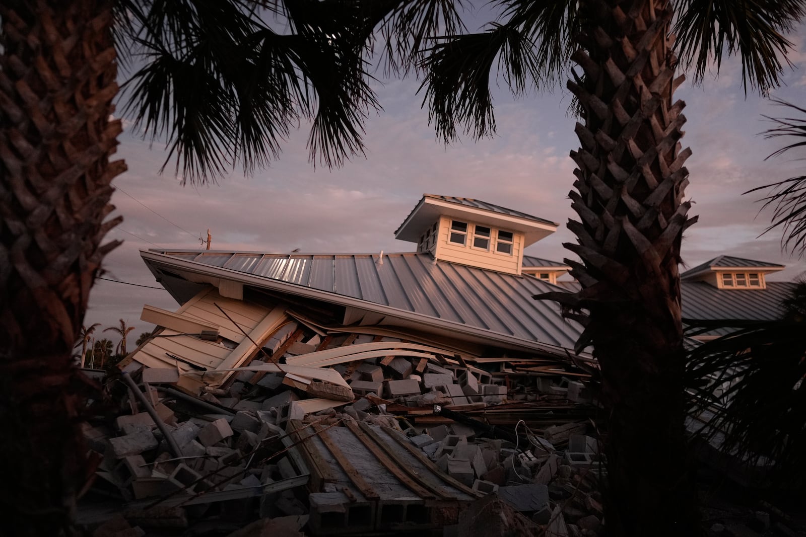 FILE - A collapsed building is visible after Hurricane Milton, on Manasota Key, Fla., Saturday, Oct. 12, 2024. (AP Photo/Rebecca Blackwell, File)