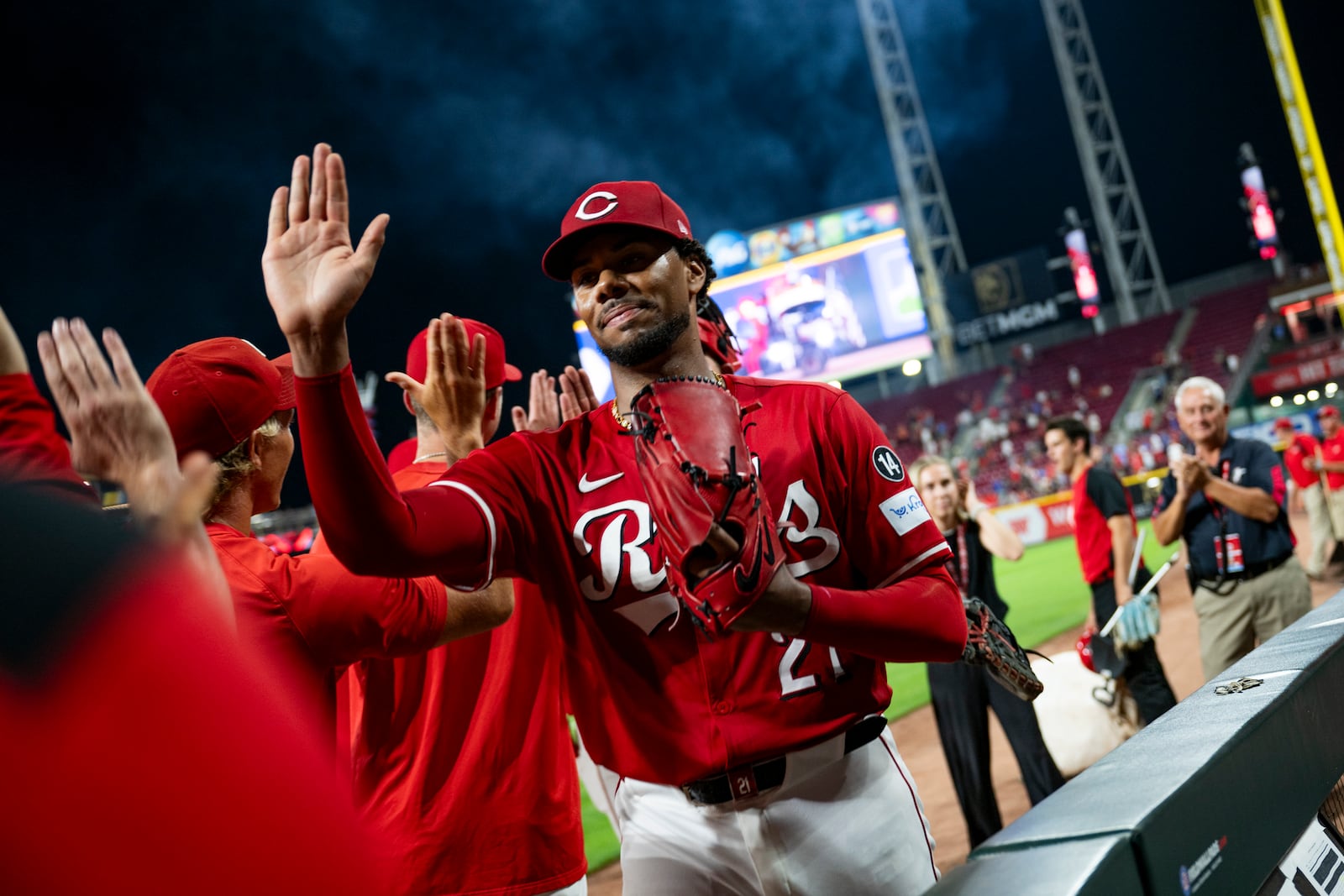 Cincinnati Reds pitcher Hunter Greene, right, high-fives teammates after striking out the last batter of a baseball game against the Chicago Cubs, Thursday, Sept. 18, 2025, in Cincinnati. (AP Photo/Michael Swensen)