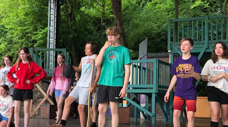 Charlie Jahns, center, leads his fellow Youth Arts Ambassadors in the cast of "Disney's Newsies Jr." during a rehearsal at the Veterans Park Amphitheater in preparing to open this year's Summer Arts Festival on Wednesday evening. The show will also be performed Thursday and Friday evenings at 8 p.m.