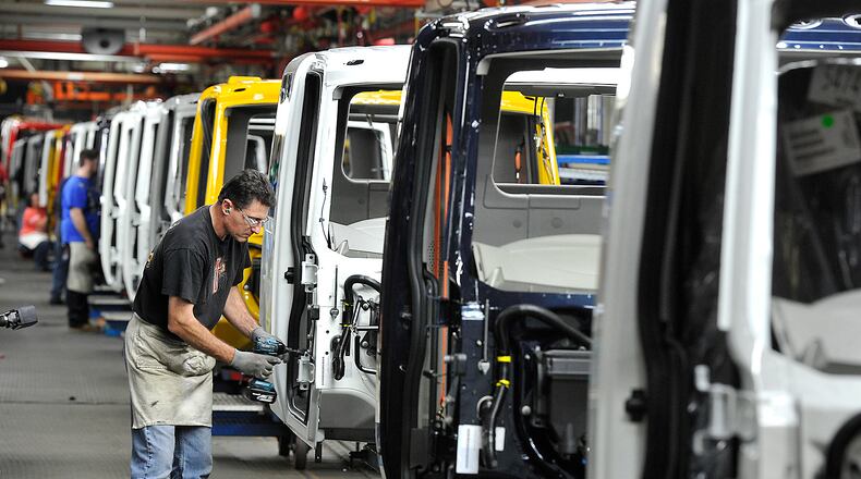 Workers assemble truck cabs at the Navistar Springfield plant. Bill Lackey/Staff