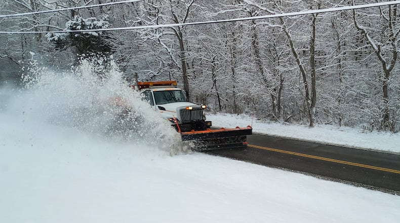 A plow clears Elk Creek Road after sveral inches of snow fell Tuesday, Dec. 2, 2025 in Madison Township in Butler County. NICK GRAHAM/STAFF