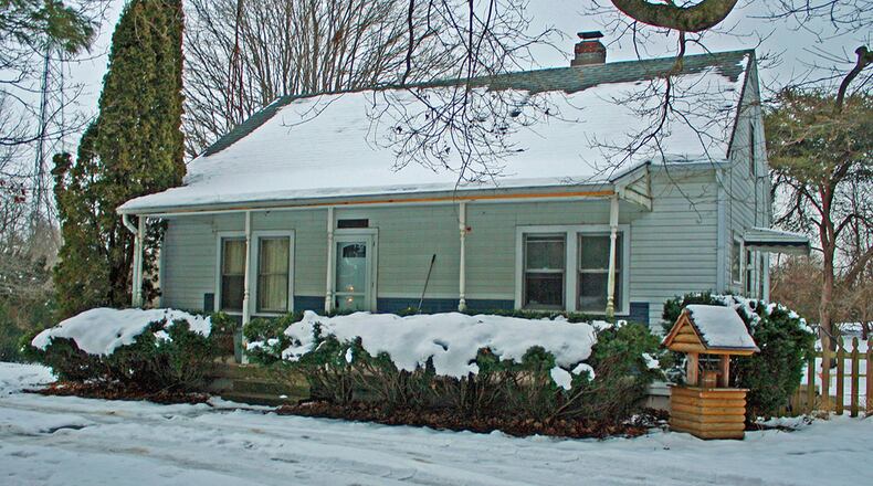This 1.5-story home with about 1,140 sq. ft. of living space sits on .9 acres. The home has an attached garage and full, unfinished, walkout basement. CONTRIBUTED PHOTO BY VICKIE KAPNAS