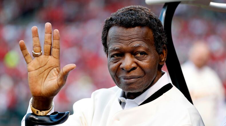 FILE - In this May 17, 2017, file photo, Lou Brock, a member of the St. Louis Cardinals' 1967 World Series championship team, takes part in a ceremony honoring the 50th anniversary of the victory before a baseball game between the Cardinals and the Boston Red Sox in St. Louis. Hall of Famer Brock, one of baseball’s signature leadoff hitters and base stealers who helped the Cardinals win three pennants and two World Series titles in the 1960s, has died. He was 81. (AP Photo/Jeff Roberson, File)