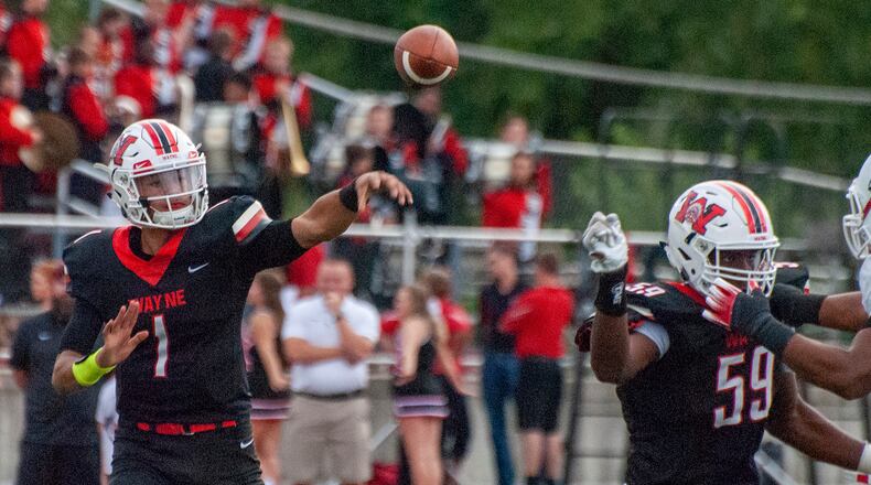 Wayne junior Cam Fancher throws during the first half of his first start as the Warriors quarterback. Jeff Gilbert/CONTRIBUTED