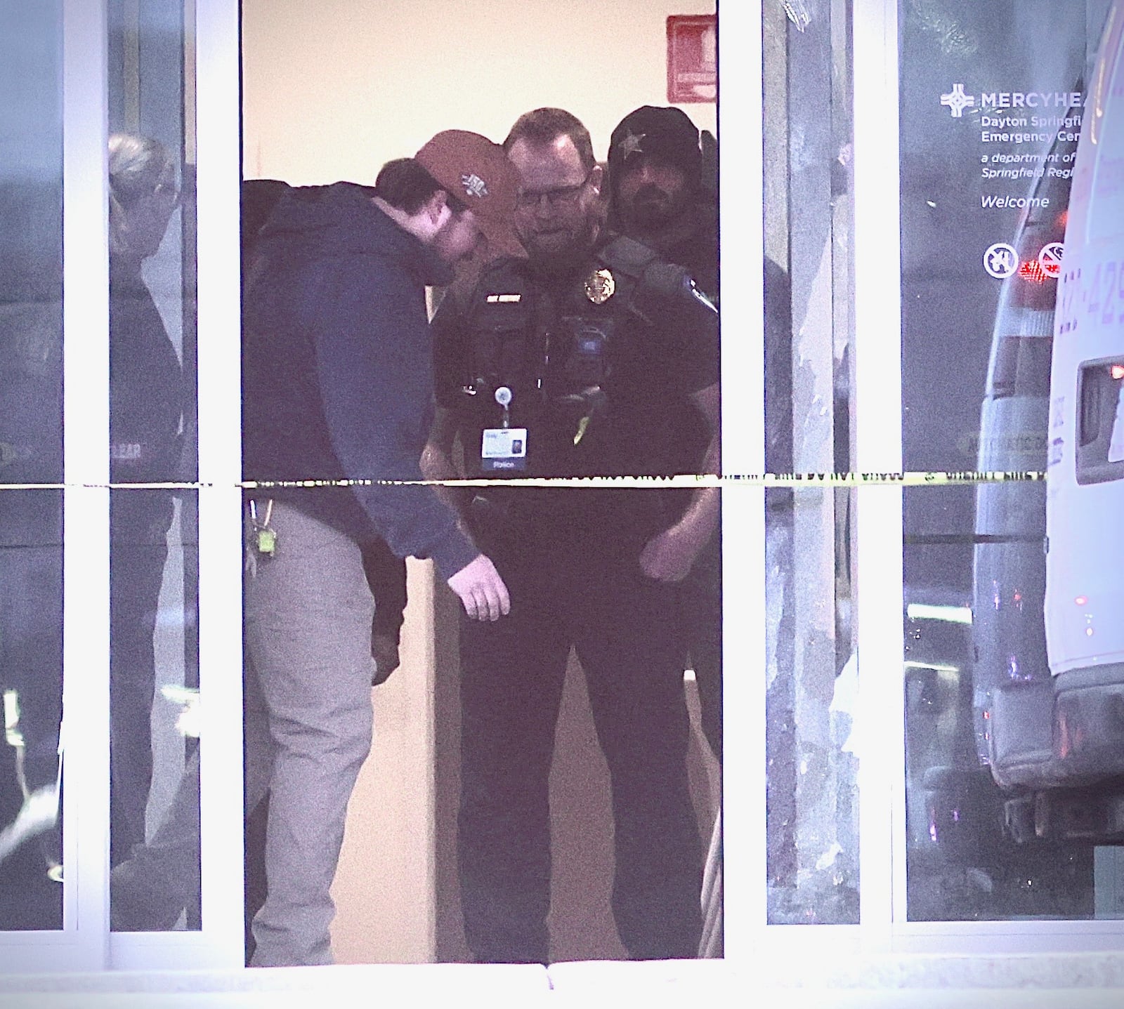Law enforcement officers check out the damage to the inside of the Mercy Health - Dayton Springfield Emergency Center on Dayton Road after a shooting incident on Sunday, Nov. 30, 2025 in Fairborn. MARSHALL GORBY / CONTRIBUTED PHOTO
