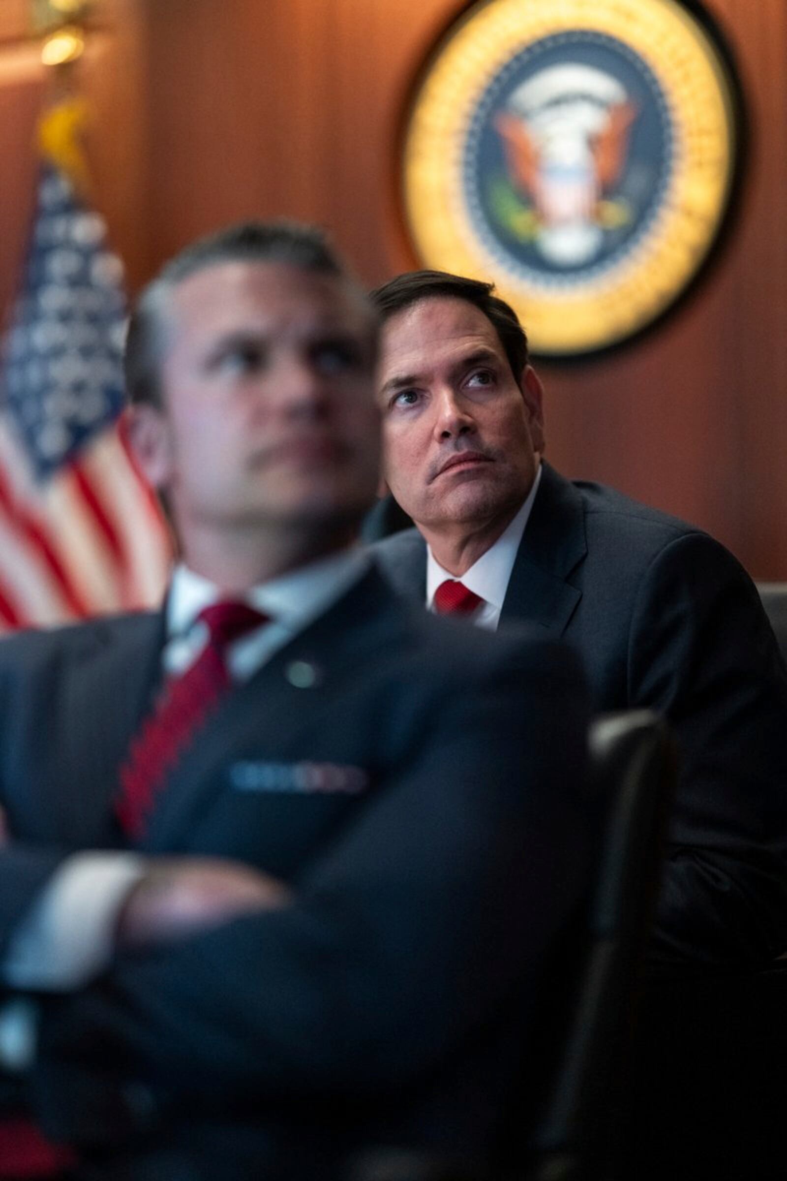 In this image provided by the White House, Defense Secretary Pete Hegseth, in foreground, and Secretary of State Marco Rubio sit in the Situation Room, Saturday, June 21, 2025, at the White House in Washington. (The White House via AP)