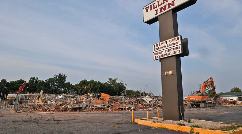 All that remains of the Villager Inn at 1715 W. North St. Monday, August 21, 2023, is the sign and a giant pile of rubble after it was demolished Saturday. BILL LACKEY/STAFF