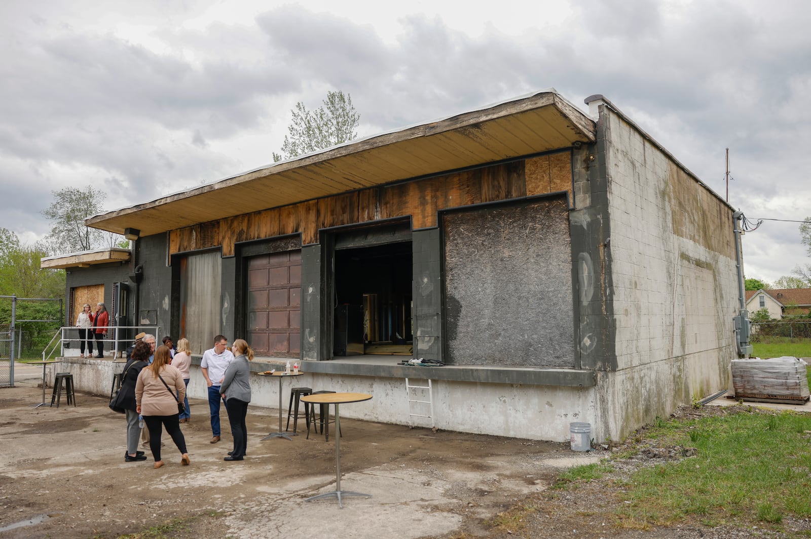 A group gathers outside a building that will be used as event space on Tuesday, May 6, 2025, at Kore 4 Konnection. JOSEPH COOKE/STAFF