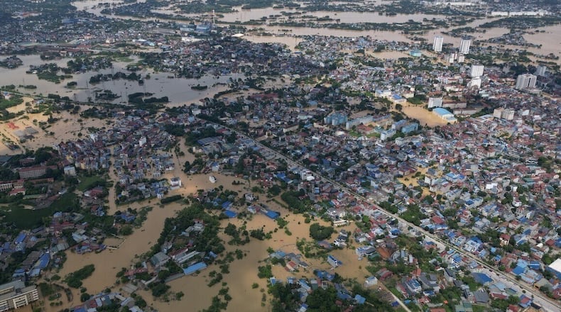 FILE- This aerial image shows flooding in the aftermath of typhoon Matmo in Thai Nguyen, Vietnam, Oct. 8, 2025. (Bui Cuong Quyet/VNA via AP, File)