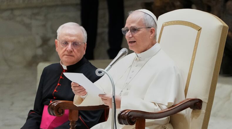 Pope Leo XIV reads his message during a weekly general audience at the Vatican, Wednesday, Feb. 11, 2026. (AP Photo/Gregorio Borgia)