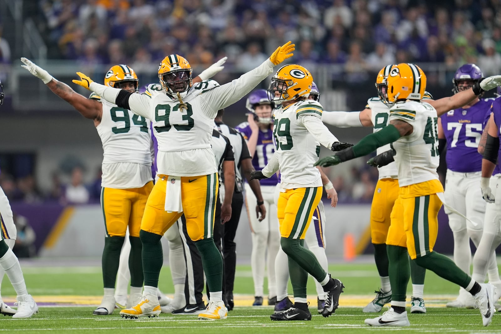 Green Bay Packers' T.J. Slaton and teammates celebrate a missed Minnesota Vikings fieldgoal during the first half of an NFL football game Sunday, Dec. 29, 2024, in Minneapolis. (AP Photo/Abbie Parr)
