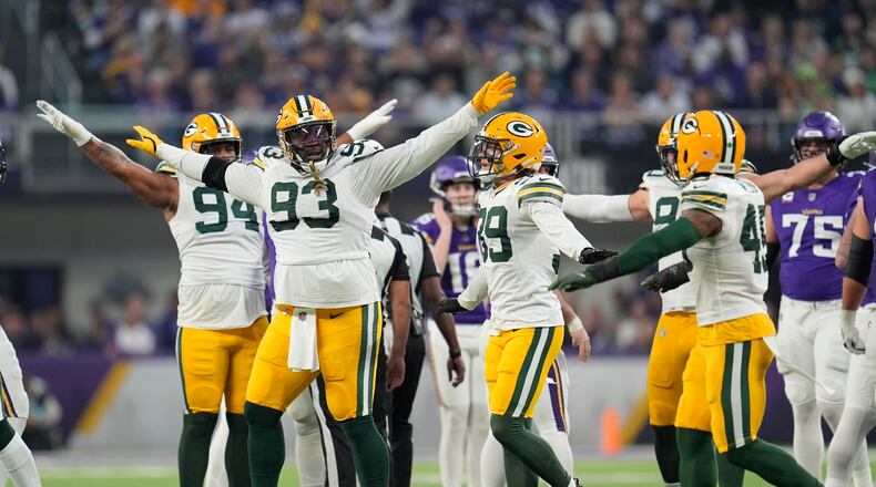 Green Bay Packers' T.J. Slaton and teammates celebrate a missed Minnesota Vikings fieldgoal during the first half of an NFL football game Sunday, Dec. 29, 2024, in Minneapolis. (AP Photo/Abbie Parr)
