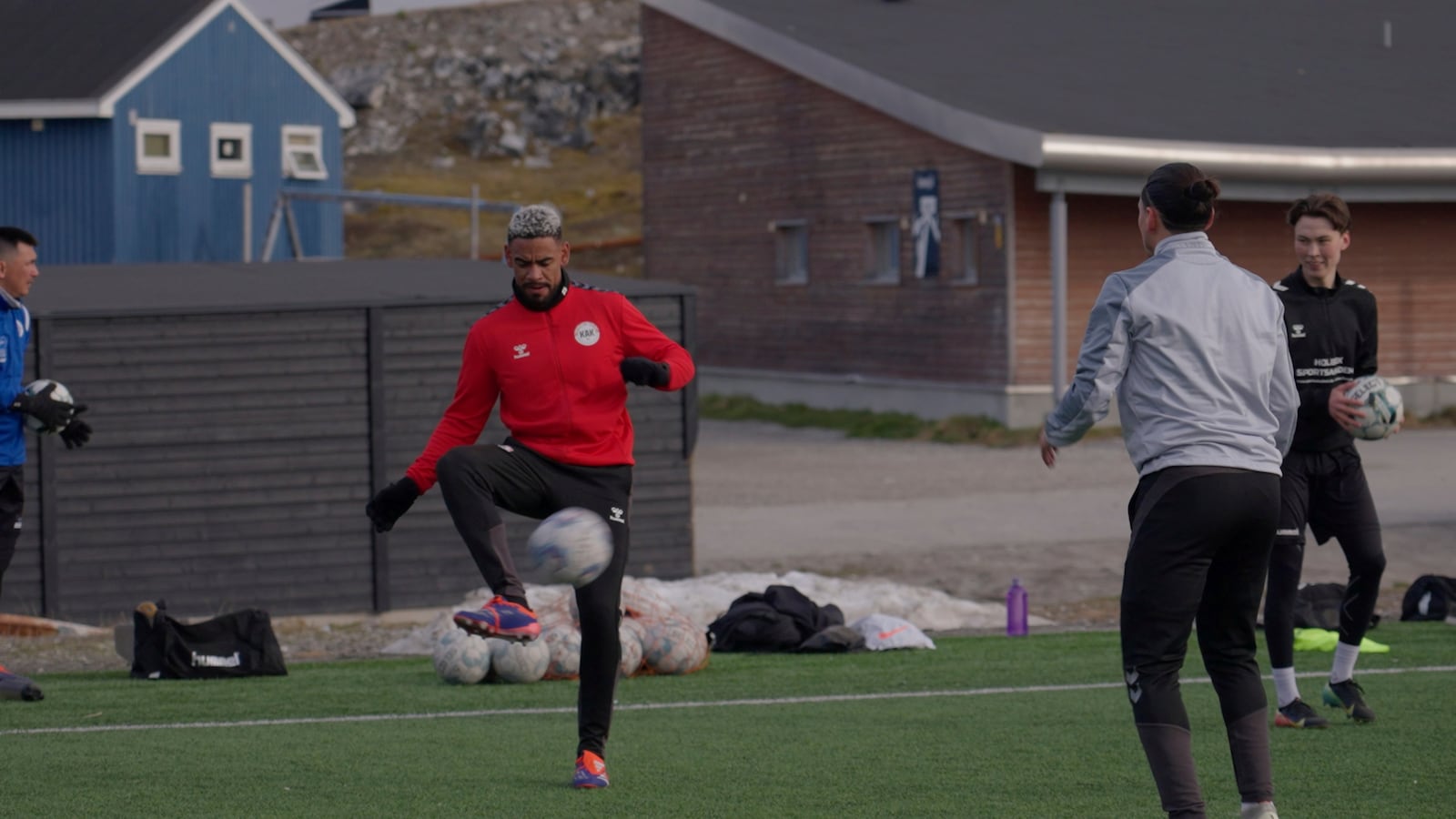 Patrick Frederiksen, captain of Greenland's national team, kicks the ball during a training session at Nuuk stadium in Nuuk, Greenland, Tuesday, June 17, 2025. (AP Photo/Kwiyeon Ha)