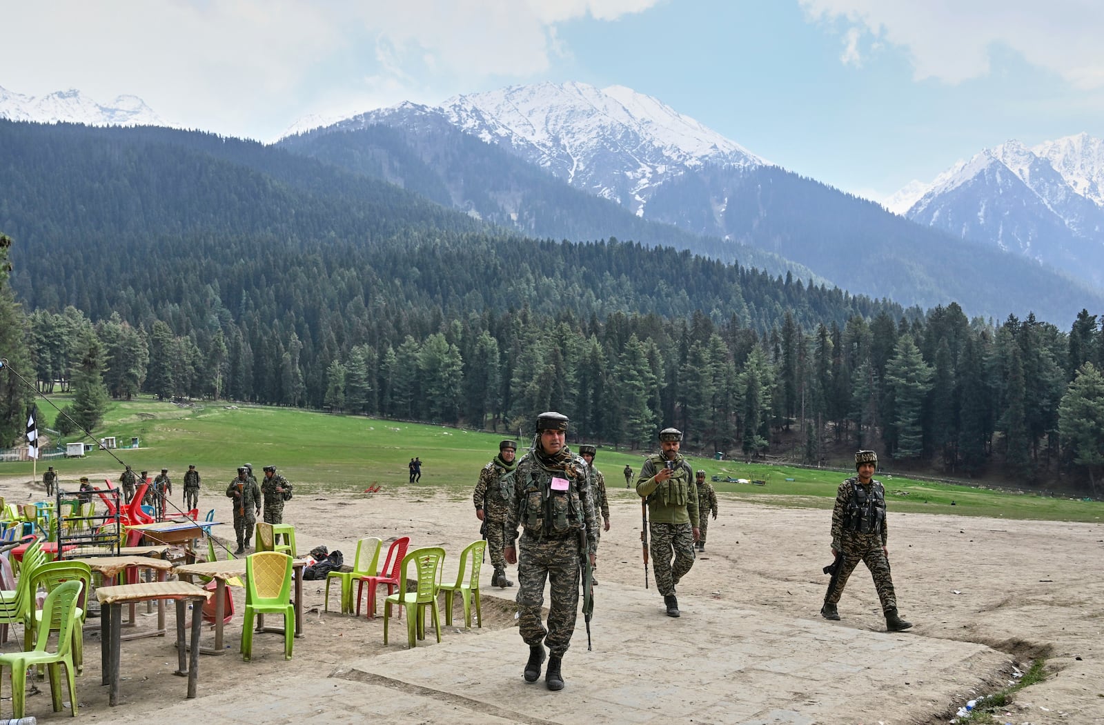 FILE - Indian security officers inspect the site a day after where militants indiscriminately opened fire at tourists in Pahalgam, Indian controlled Kashmir, Wednesday, April 23, 2025. (AP Photo, File)