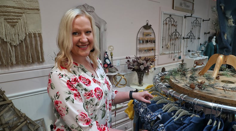 Kari Johnston has been busy getting her new boutique ready for its Nov. 5 opening. The Rose City Boutique is located at 115 East Ward St. and features products from several different local vendors.  BILL LACKEY/STAFF