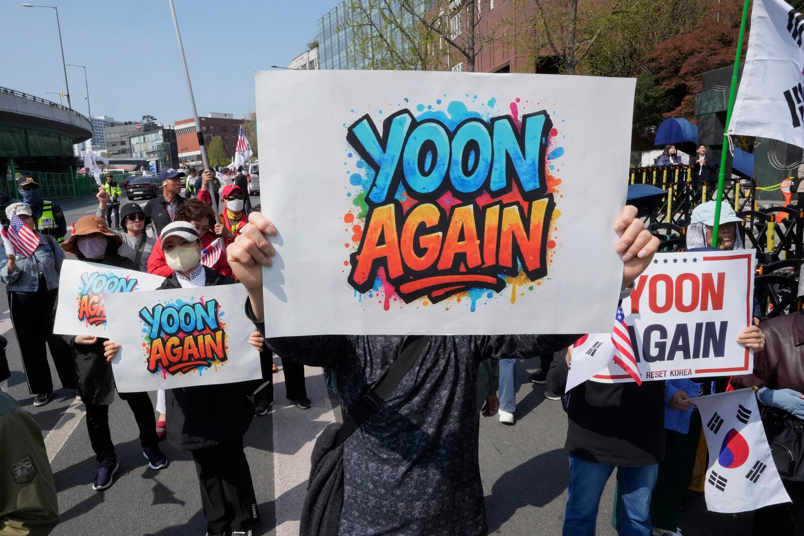 Supporters of recently ousted South Korean President Yoon Suk Yeol attend a rally to oppose his impeachment near the presidential residence in Seoul, South Korea, Friday, April 11, 2025. (AP Photo/Ahn Young-joon)