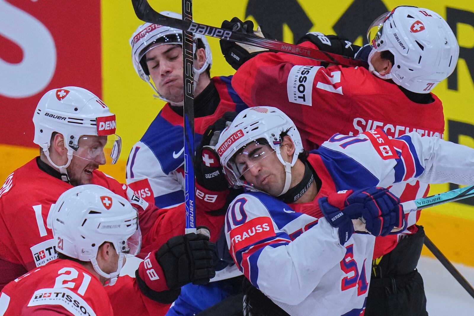 Switzerland's Jonas Siegenthaler checks United States' Frank Nazar during the final match between United States and Switzerland at the ice hockey world championships in Stockholm, Sweden, Sunday, May 25, 2025. (AP Photo/Petr David Josek)