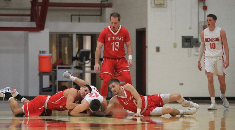 Wittenberg’s Jake Bertemes, left, and Jordan Pumroy, right, chase a loose ball against Denison on Wednesday, Jan. 8, 2020, at Livingston Gymnasium in Granville. David Jablonski/Staff