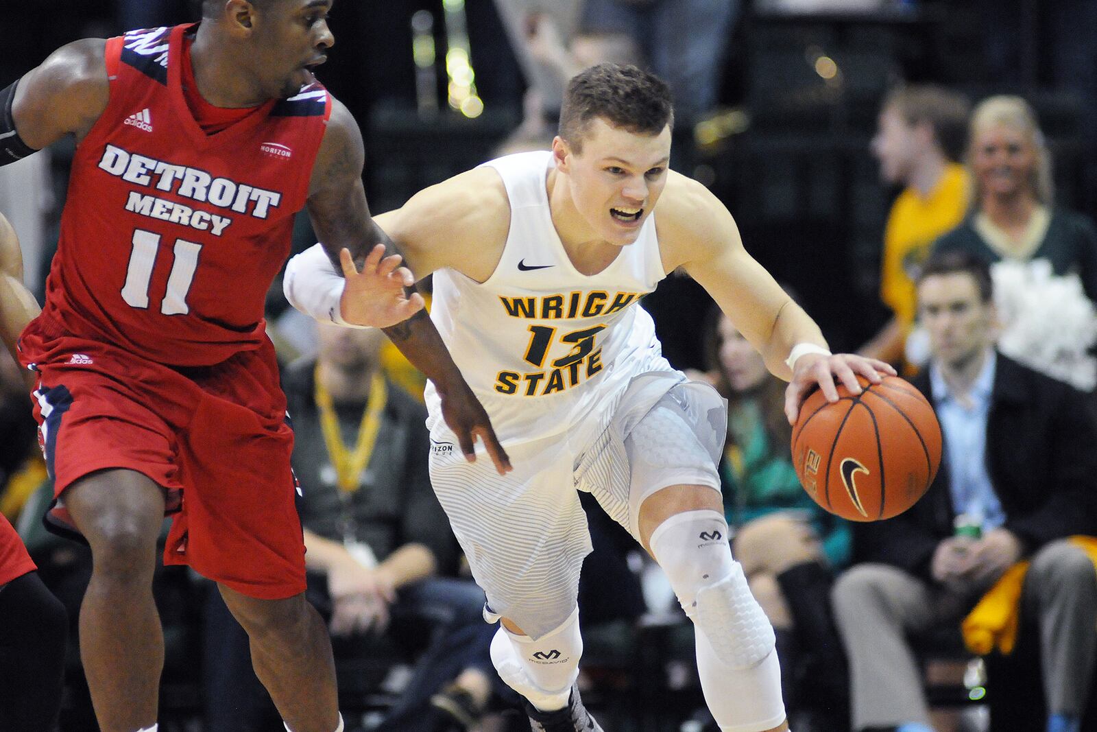 Wright State junior guard Grant Benzinger brings the ball up the court against Detroit’s Jarod Williams during the Raiders 106-88 win Jan. 20. KEITH COLE/SUBMITTED PHOTO