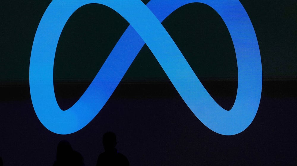 FILE -A Meta logo is shown on a video screen at LlamaCon 2025, an AI developer conference, in Menlo Park, Calif., April 29, 2025. (AP Photo/Jeff Chiu, File)