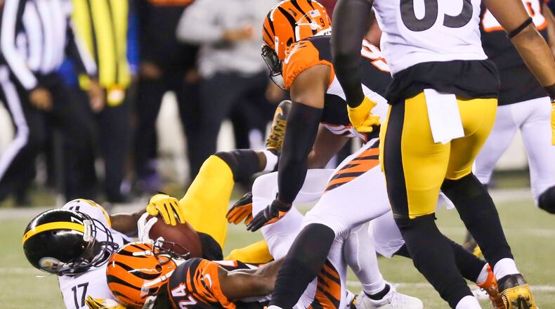 Adam Jones makes an interception for the Bengals during their game against the Steeler at Paul Brown Stadium, Monday, Dec. 4, 2017. GREG LYNCH / STAFF