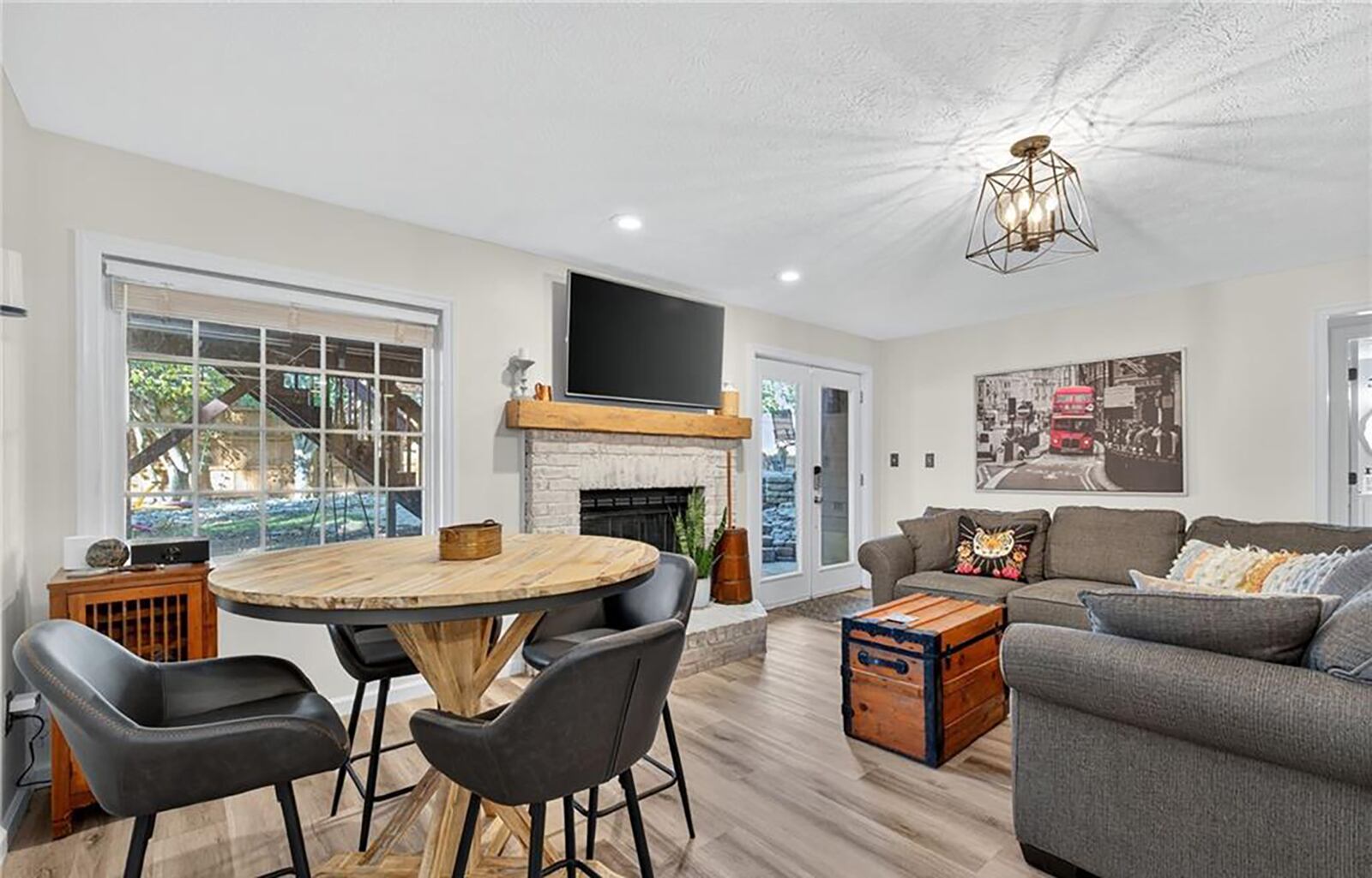 The finished basement has a walk out recreation room with new luxury vinyl plank flooring, a wet bar and a fireplace. It walks out to the pool area. CONTRIBUTED