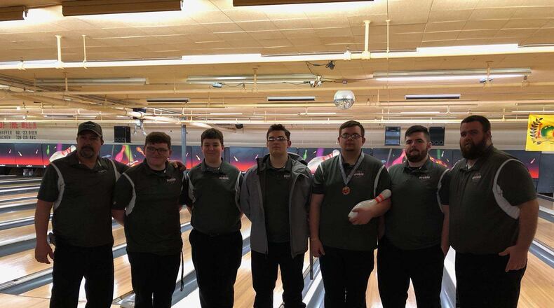 The Urbana bowling team recently rolled a pair of 300 games — one as a team and one from Justin Brown — during matches they dedicated to honor Gary Oakes Sr., the coach’s father, and Troy Byrd, an 11-year old who died while playing basketball. From left to right: Coach Jason Brown, Andru Troyer, Kolin Bowdle, Austin Fisher, Justin Brown, Wyatt Young and coach Richard Oakes (missing are Jacob Coffey, Nate Wright and Austin Anderson).