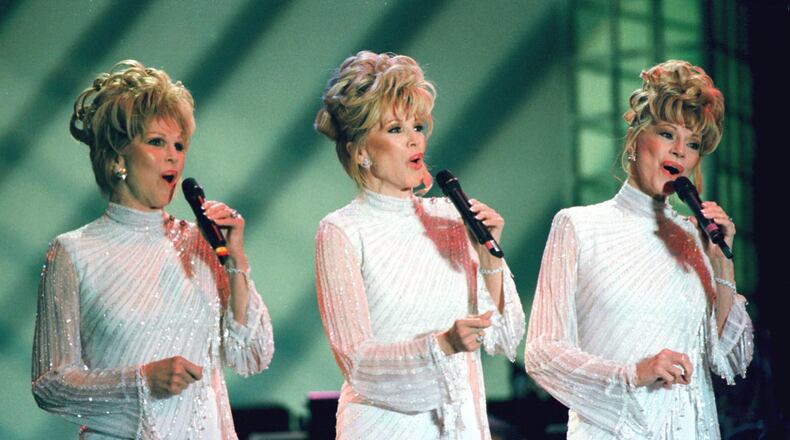 The McGuire Sisters, with lead singer, Phyllis McGuire, center, are shown in this June 12, 1999, file photo. “We’d like to put together something like a special concert in New York City, where it all began,” Phyllis McGuire said Monday Jan. 3, 2000 as she and sisters Dorothy and Christine prepared for a four-night engagement. (AP Photo/Las Vegas News Bureau, Glenn Pinkerton, HO)