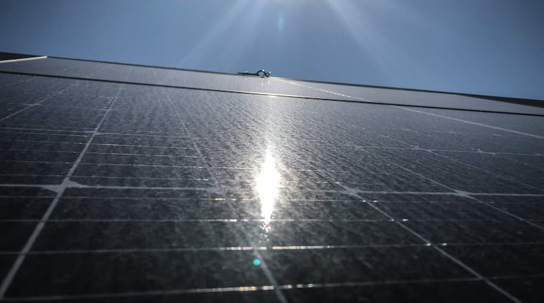 The sun shining on a solar panel in Miamisburg. JIM NOELKER/STAFF