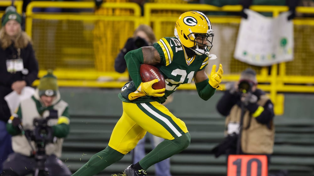 FILE - Green Bay Packers cornerback Nate Hobbs returns a kick off during an NFL football game between the Green Bay Packers and Baltimore Ravens, Dec. 27, 2025, in Green Bay, Wis. (AP Photo/Matt Ludtke, File)