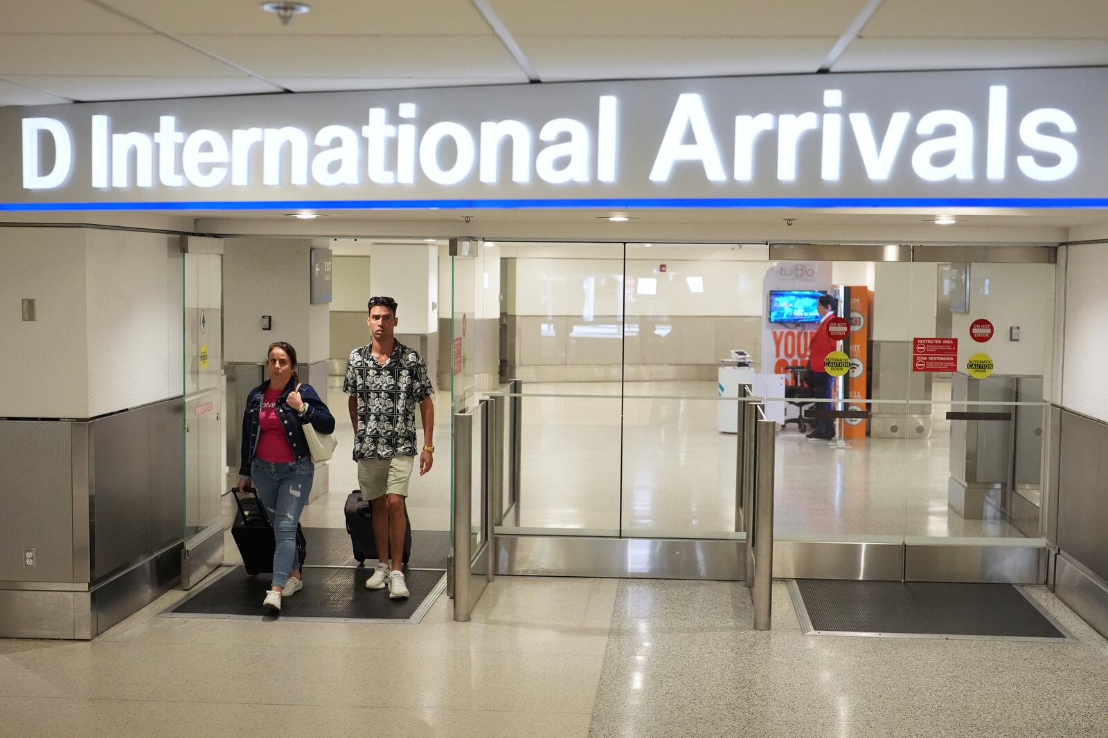 Luis Hernandez, 33, right, who traveled to Cuba for the Weekend arrives at Miami International Airport, Monday, June 9, 2025, in Miami. (AP Photo/Rebecca Blackwell)